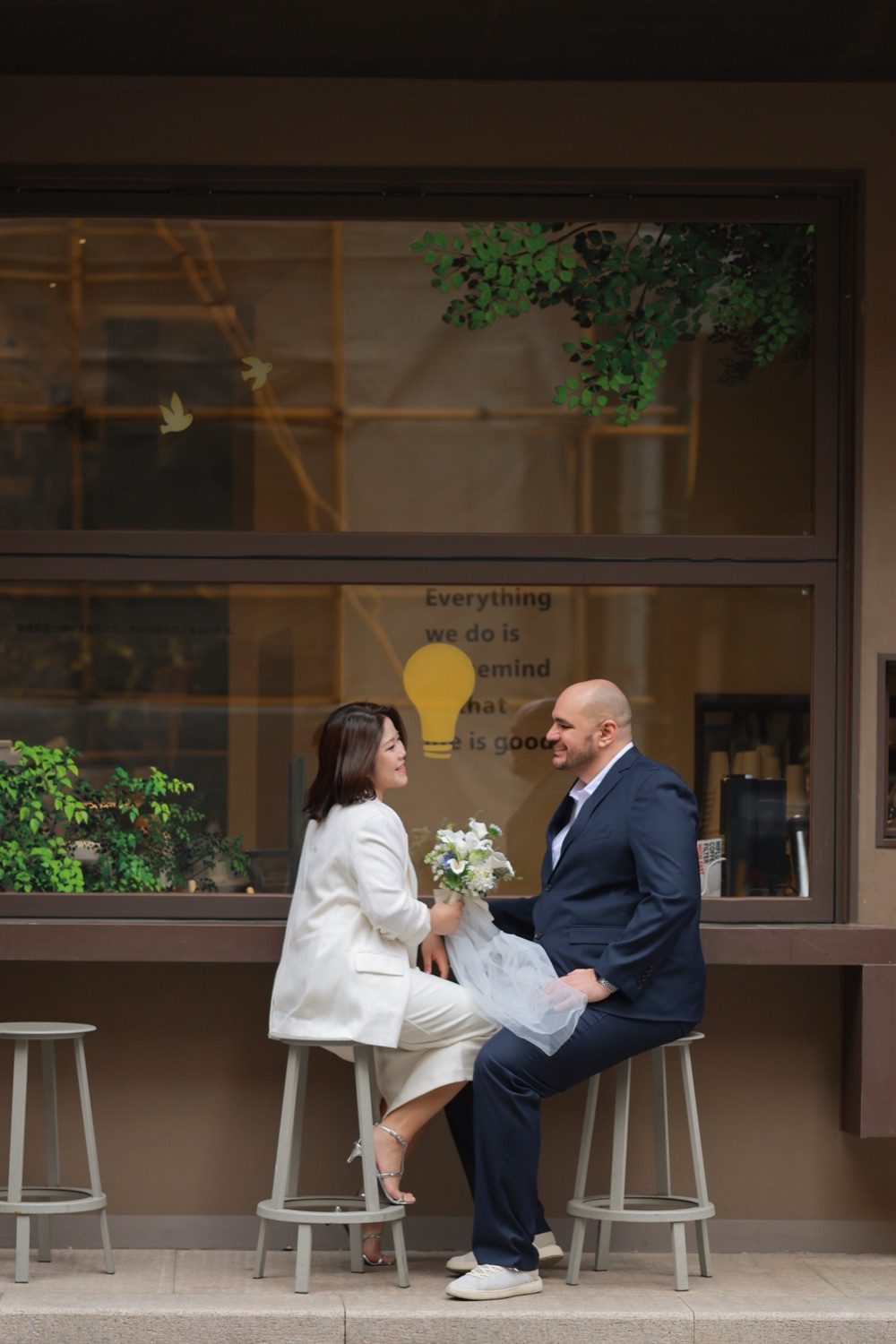 Sharing a laugh at a little café window